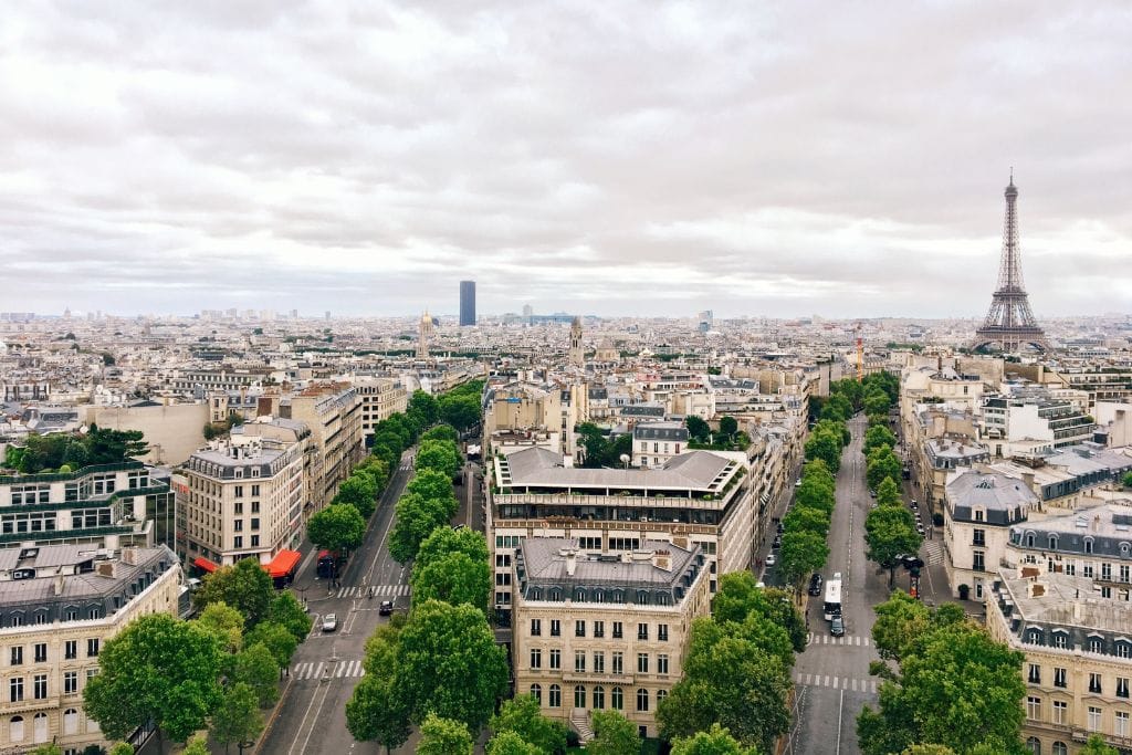 A view of Paris in the summer with the Eiffel Tower in the background.