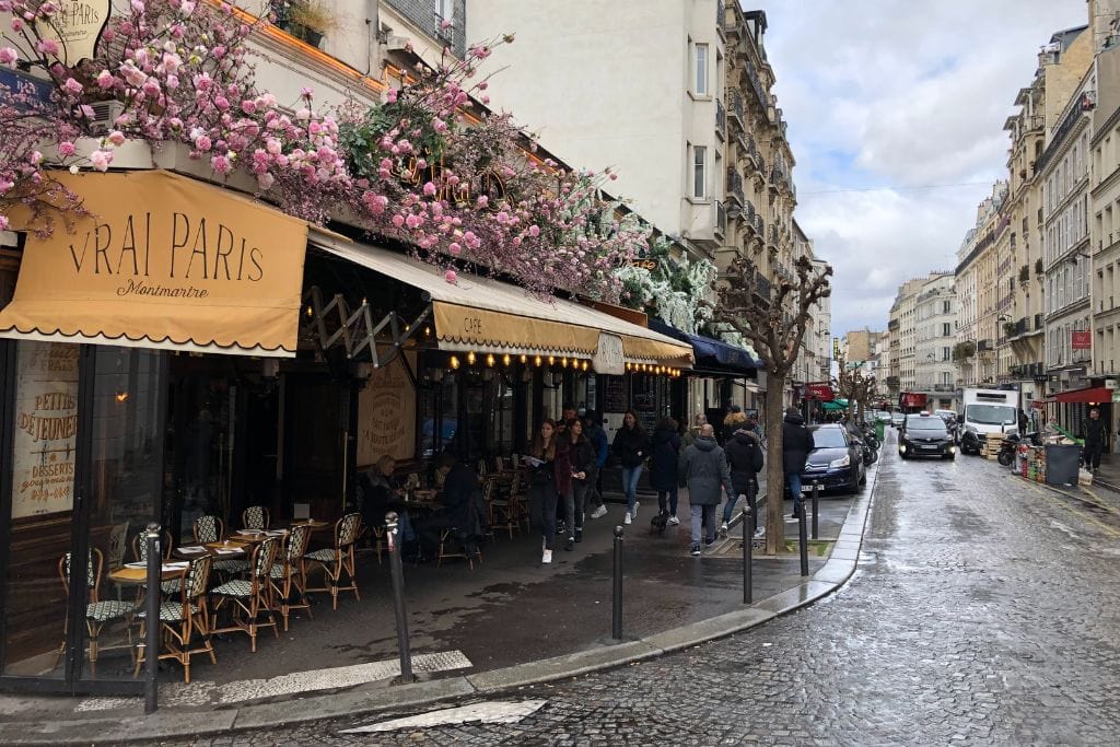 An outdoor cafe in Paris in May. The perfect spot to sit, drink an espresso or wine and people watch.