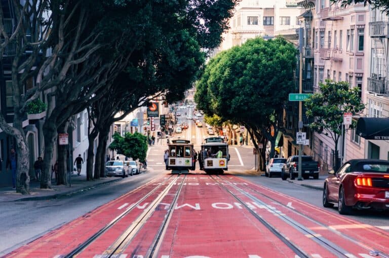 Two cable cars on a steep San Francisco, California.
