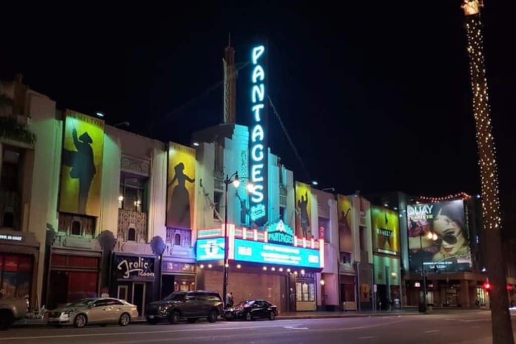 The front of the Pantages Theatre at night on Hollywood Boulevard.