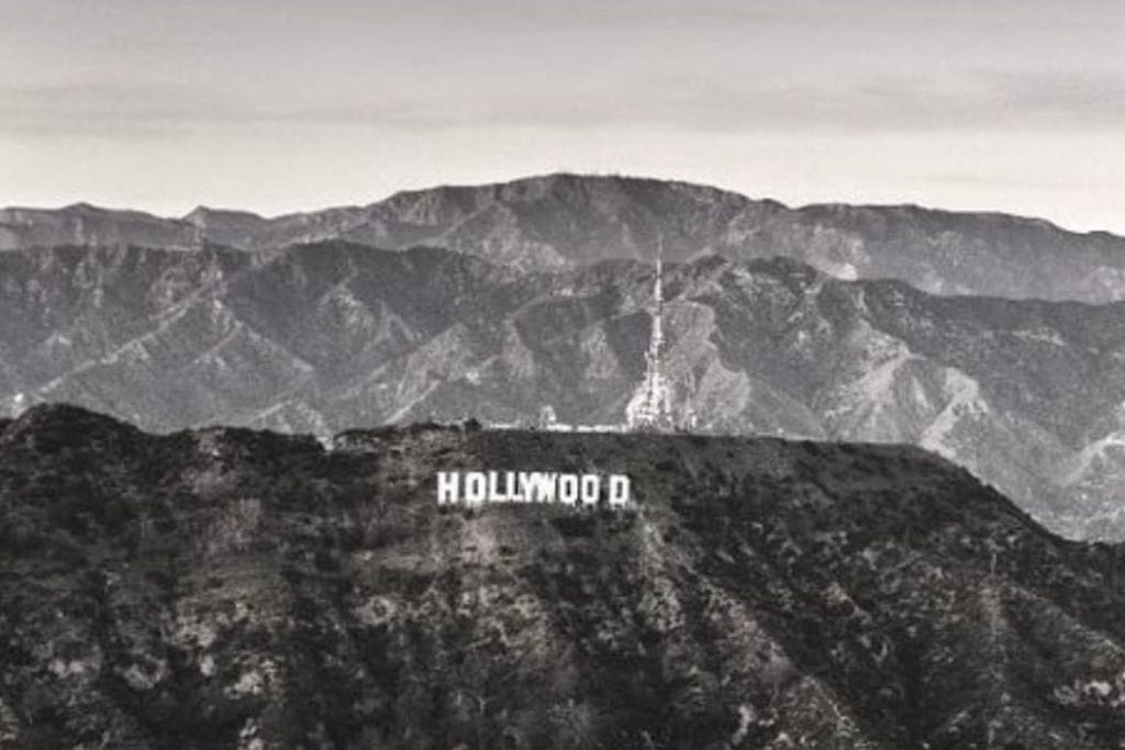 The Hollywood Sign on Mount Hollywood in black and white photography.