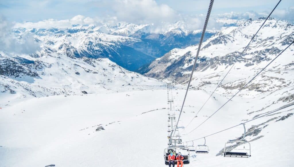 A ski lift on a snowy mountain.