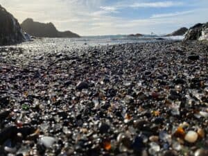 A beach covered with sea glass at Fort Beach in California.