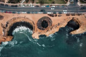 An aerial view of Sunset Cliffs Sea Cave and other sea caves in San Diego's Sunset Cliffs Natural Park.