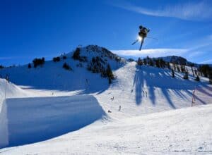 A skier in the air on Mammoth Mountain in California. Mammoth Mountain received the most snow in 2023. A whooping 700 inches of snowfall.
