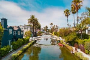A canal in Venice Beach, California lined by California houses.